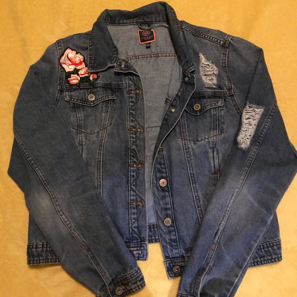 Jean jacket with rose patches.